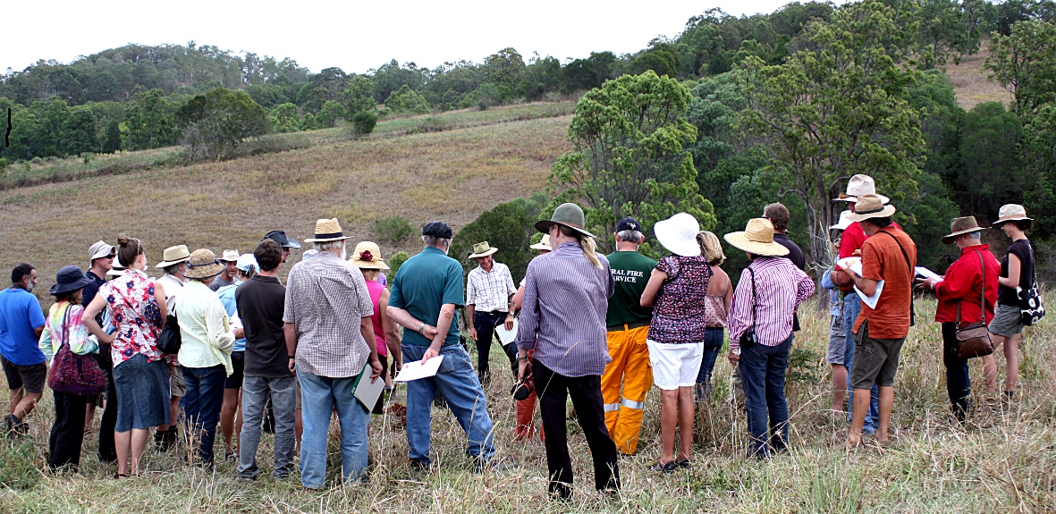 Graeme Elphinstone getting people to look at a soil profile at the October 2013 field day.